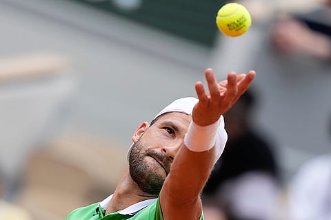 Grigor Dimitrov serves against Jannik Sinner